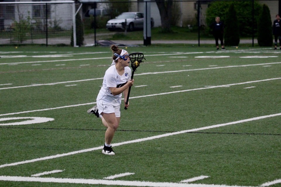 Leigha Johnson playing lacrosse